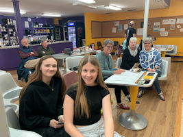 More eople at the bowling alley.